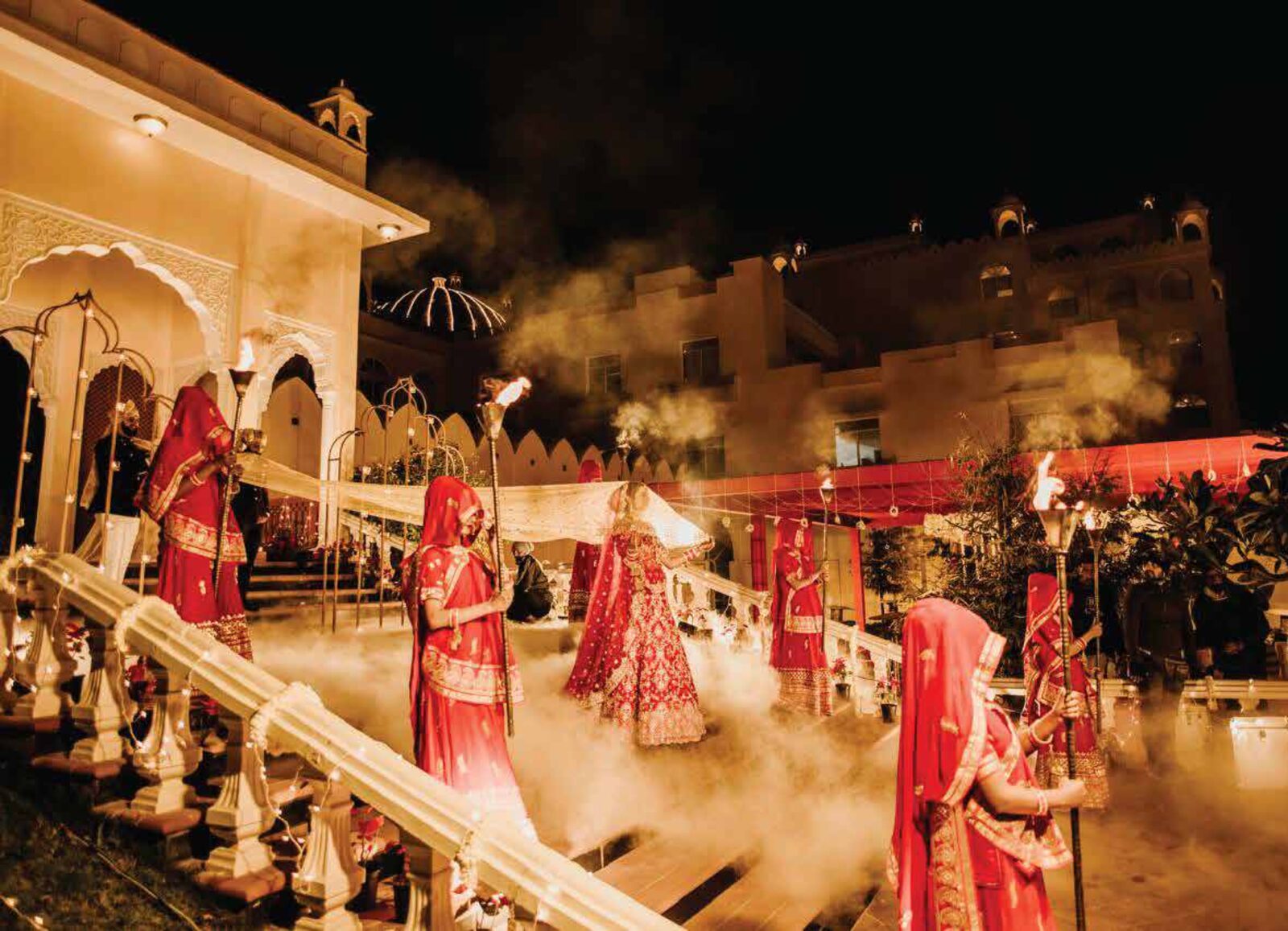 A candlelit royal wedding procession at a heritage Rajasthan palace, curated by Aavaline